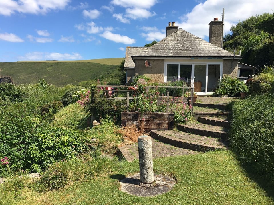 Seaside Retreat in sheltered sunny spot with beautiful views to the ocean.