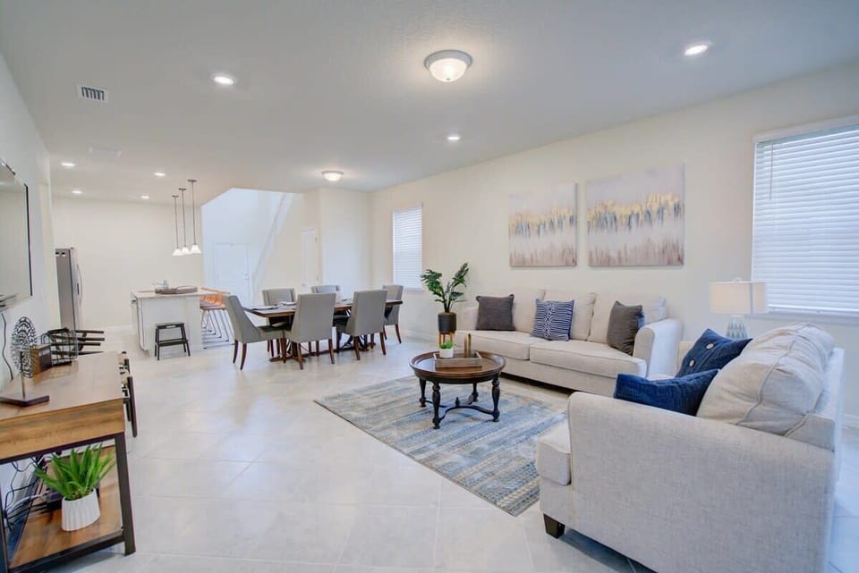 Spacious and stylish living area with modern comforts, perfect for relaxing and dining with family or friends.