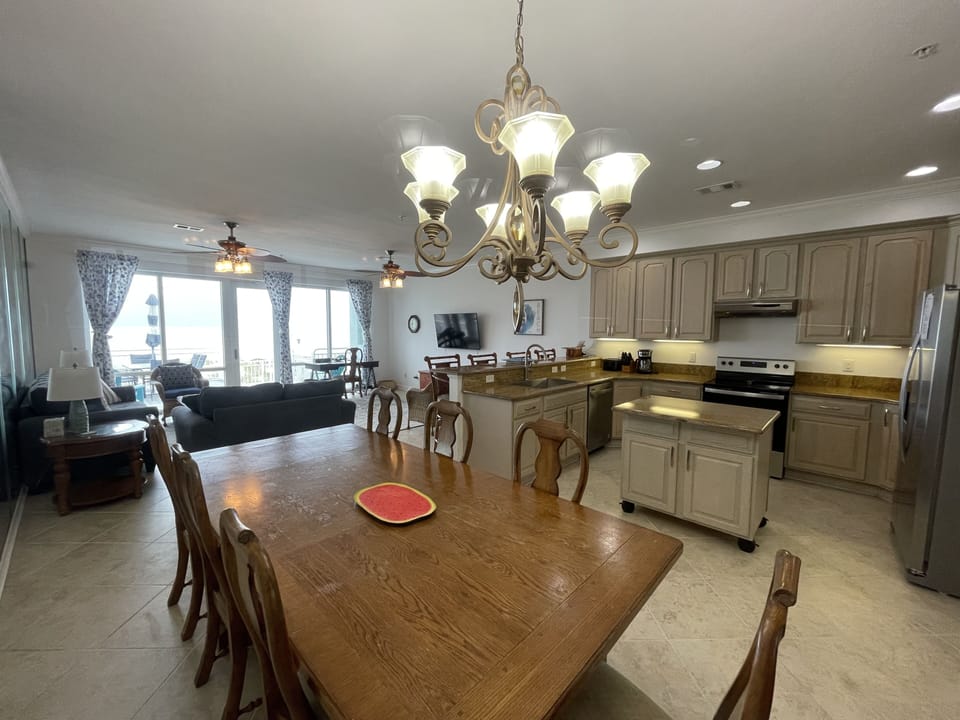 Large dining area adjacent to kitchen and living area