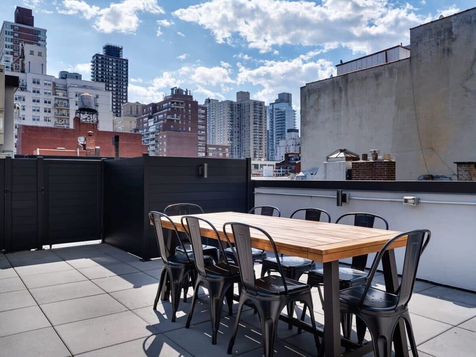 Roof top deck with a dining table and even better views.