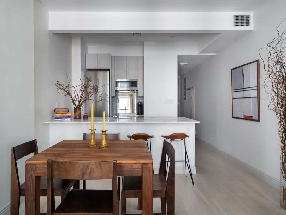 Dining table overlooking kitchen and hallway