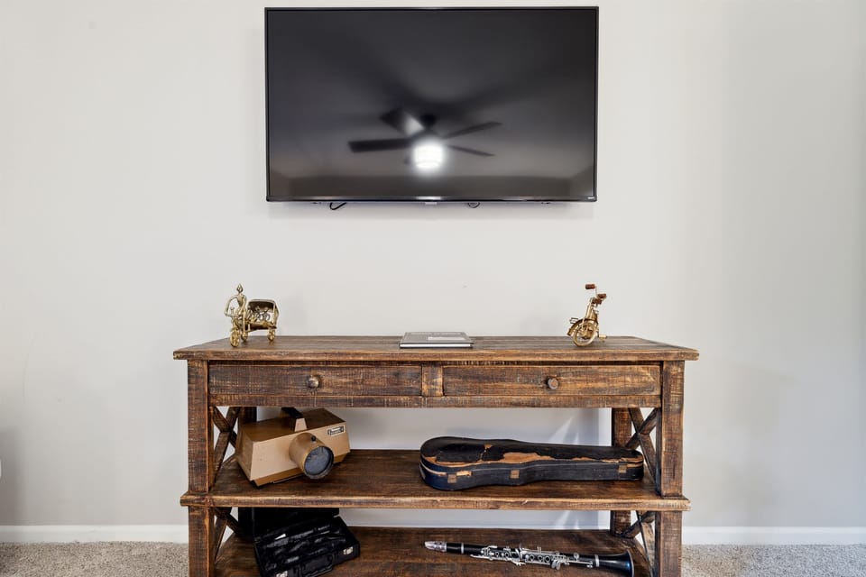 Master bedroom upstairs with king bed, Roku TV, and private balcony