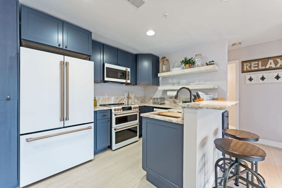 Luxury appliances--new full-sized fridge, double oven with electric range, sterilizing dishwasher
