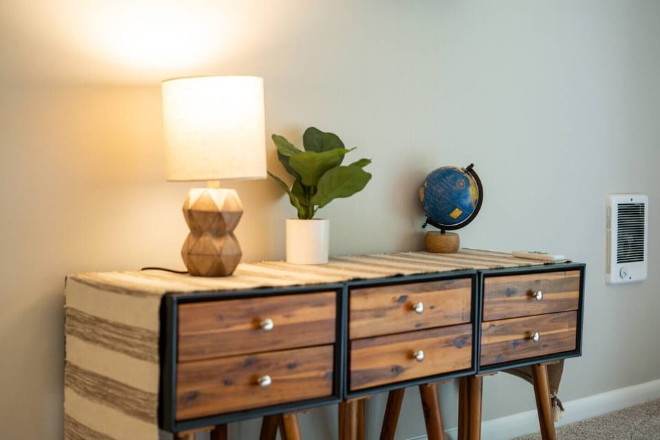 First bedroom includes a queen bed, Roku TV, and private balcony