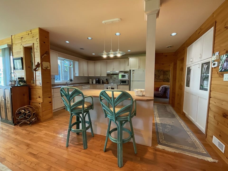 Open concept kitchen with counter seating.