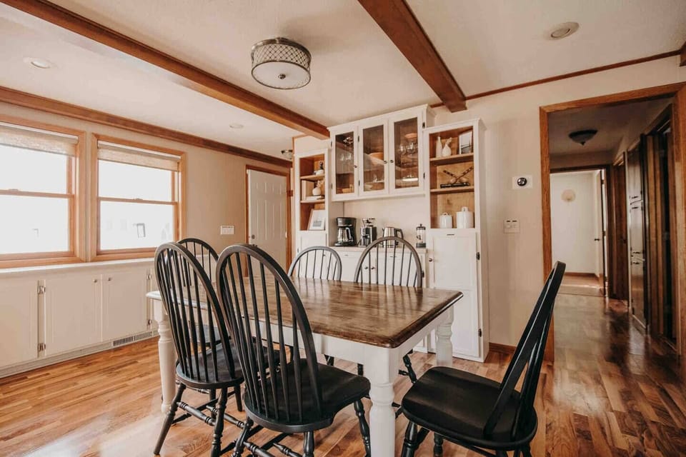 Open concept dining room into kitchen w/ 3 main level bedrooms + bathroom. 