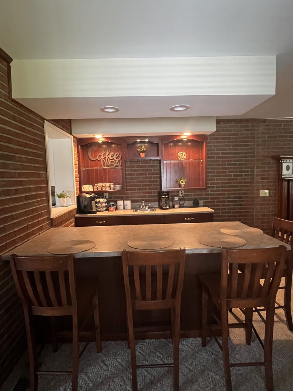 Coffee bar stocked w/coffee grounds with Grinder and Keurig machine w/ K cups.