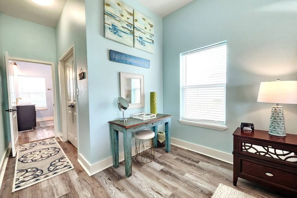 Get ready with ease at the vanity table featuring a magnifying mirror. Master bedroom with adjoining en suite master bath. 