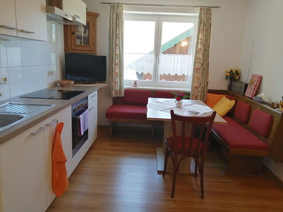 Furniture, Cabinetry, Countertop, Wood, Sink, Interior Design, Kitchen Appliance, Kitchen Stove, Table, Houseplant