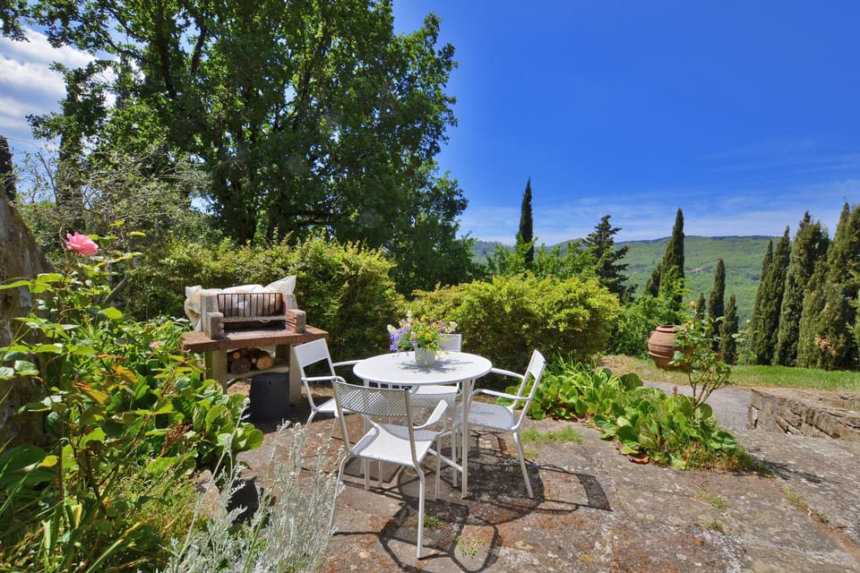 One of the several equipped spaces in the lawn surrounding the Villa