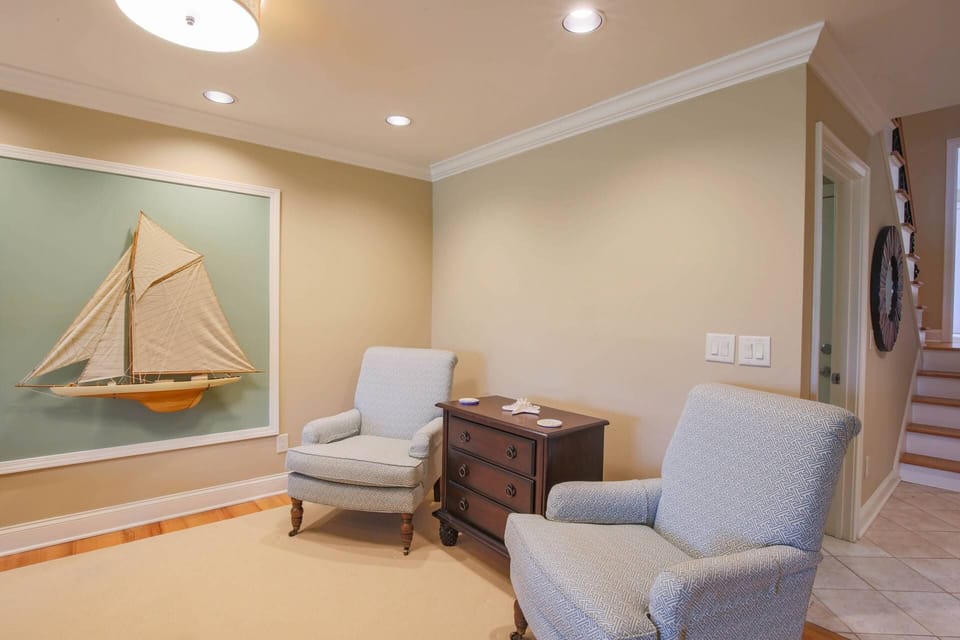 The home's three bedrooms are located off of the stairwell near the entryway.
