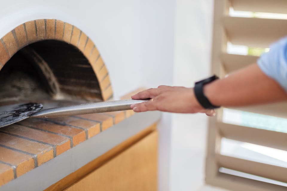 A wood oven is also available outdoors, next to the BBQ facilities.