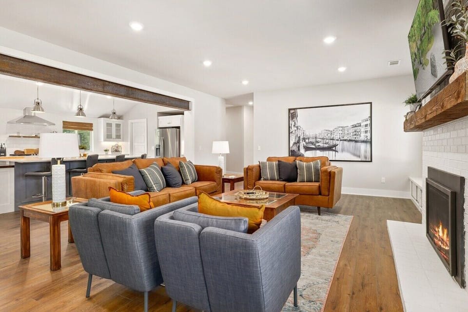 In the living room you'll find a leather couch, a leather loveseat and two lounge chairs. Settle in for a movie on our 65-inch Samsung Smart TV or curl up with a book in front of our working gas fireplace!