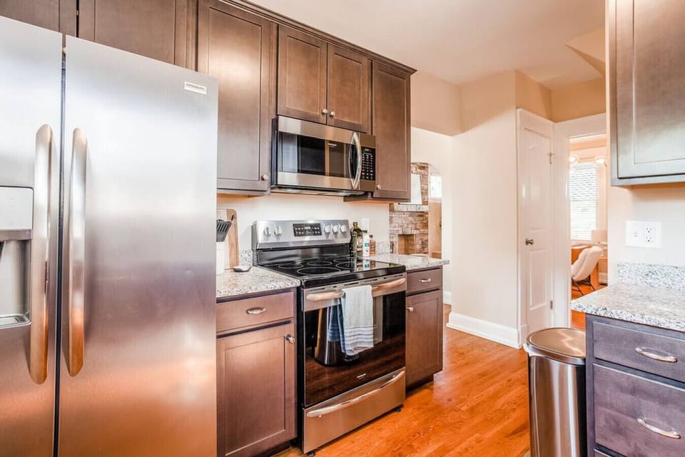 Updated kitchen with small kitchen appliances in cabinets