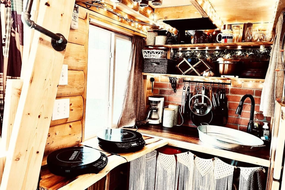 Here`s the kitchen with a few modifications:1) The ladder is folded up2) An extended countertop is folded out. 3) Two induction burners are provided for cooking or boiling anything you`d like.