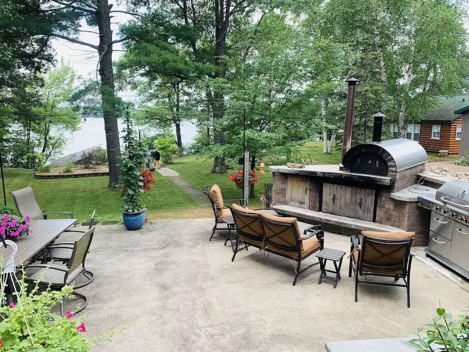 Patio area outside the main house overlooking the lake and boathouse.
