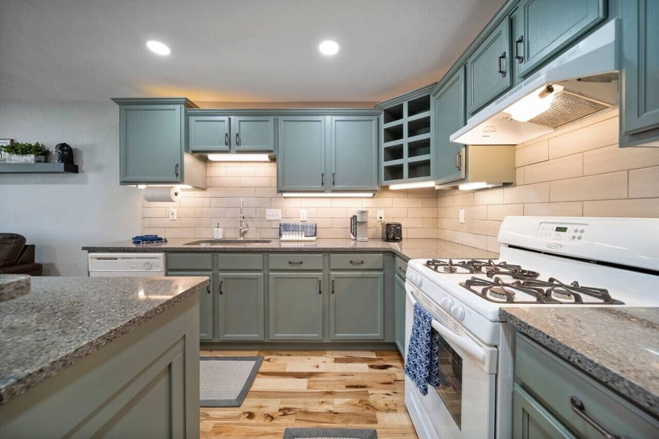 The full kitchen is stocked with all of the essentials! Spices, pans, pots, cooking sheets, and utensils.