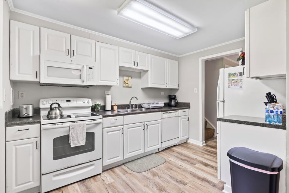 Full size kitchen, microwave, coffee pot, blender and other appliances. 