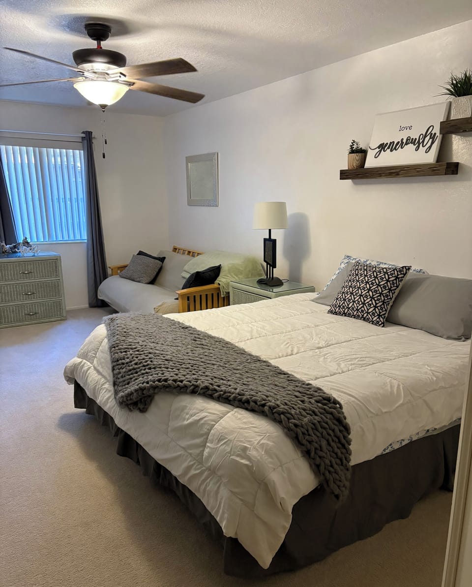 Primary bedroom with king bed and daybed