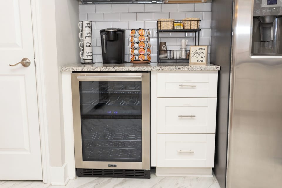 Fully stocked coffee and tea bar, wine cooler, glasses and an electric wine opener.