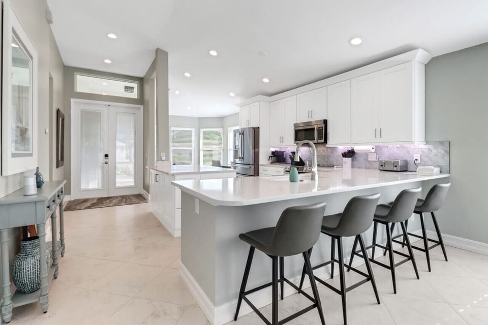Entryway opens to large kitchen.