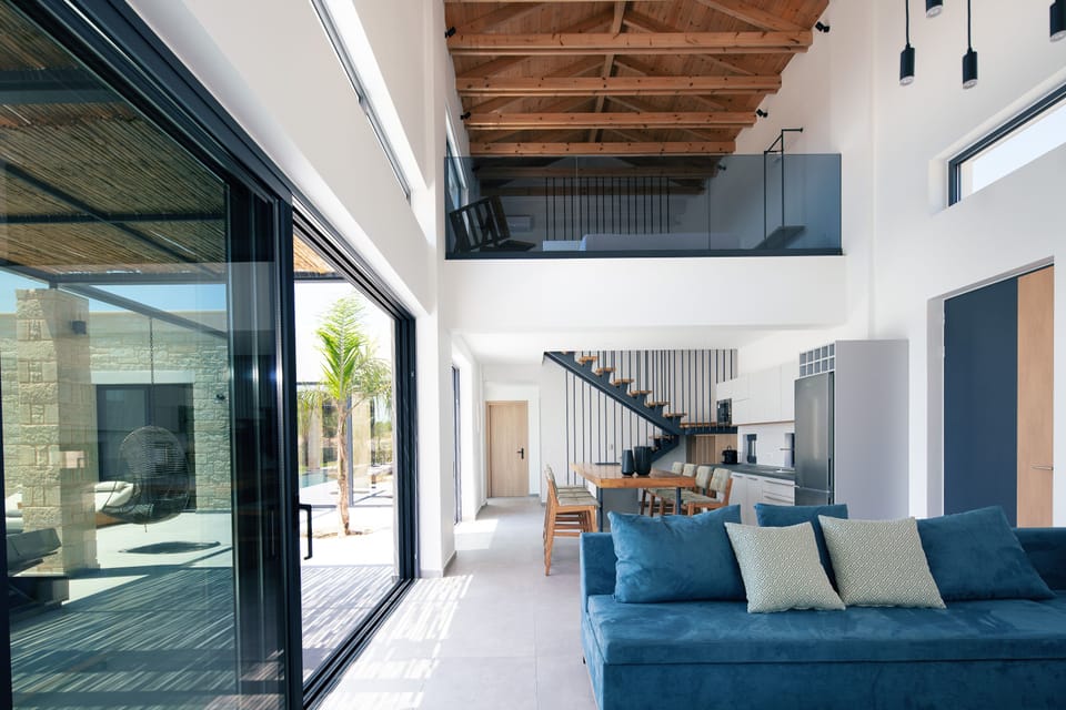 The villas open-plan design connects the living room, kitchen, and outdoors, ideal for entertaining.
