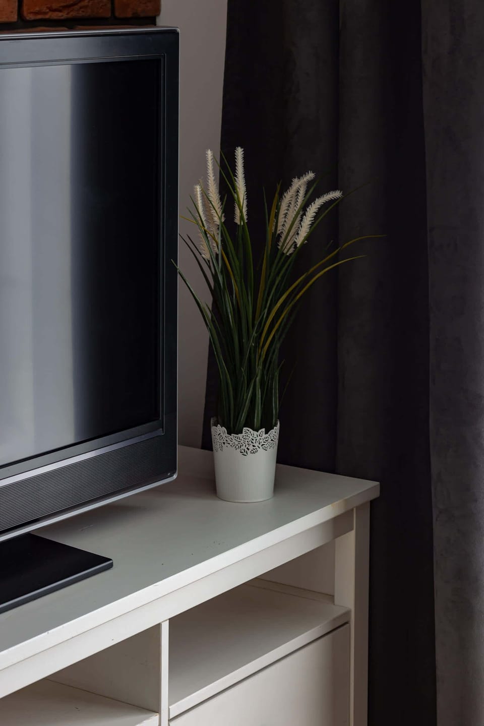A small decorative shelf in the living room, creating a cozy and welcoming atmosphere.
