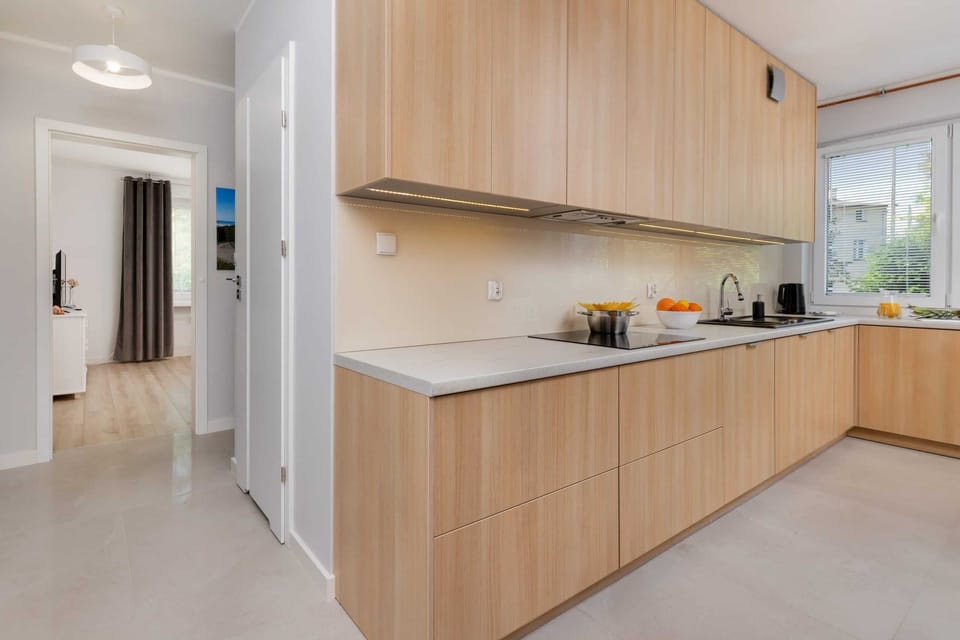 Another angle of the kitchen showcasing its functional layout and clean, minimalistic design.

