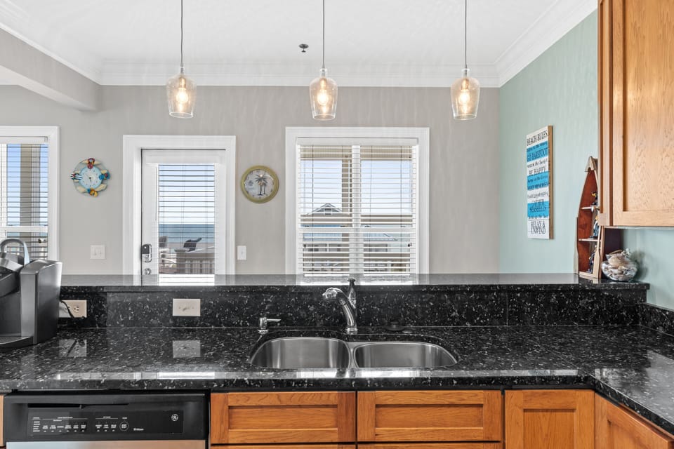 full kitchen with bar seating and dining area