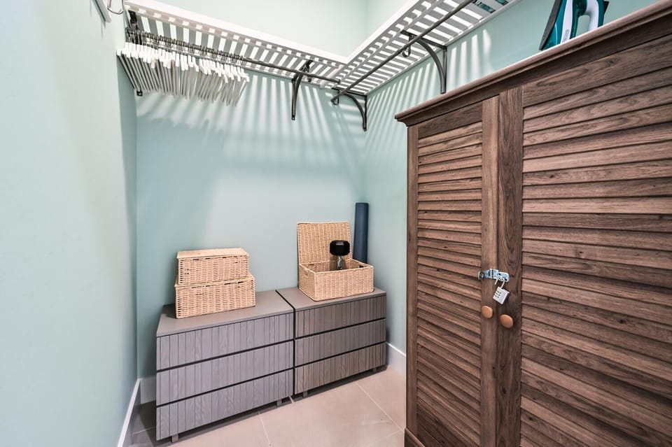 Main bedroom walk-in closet with workout equipment 🏋️‍♂️