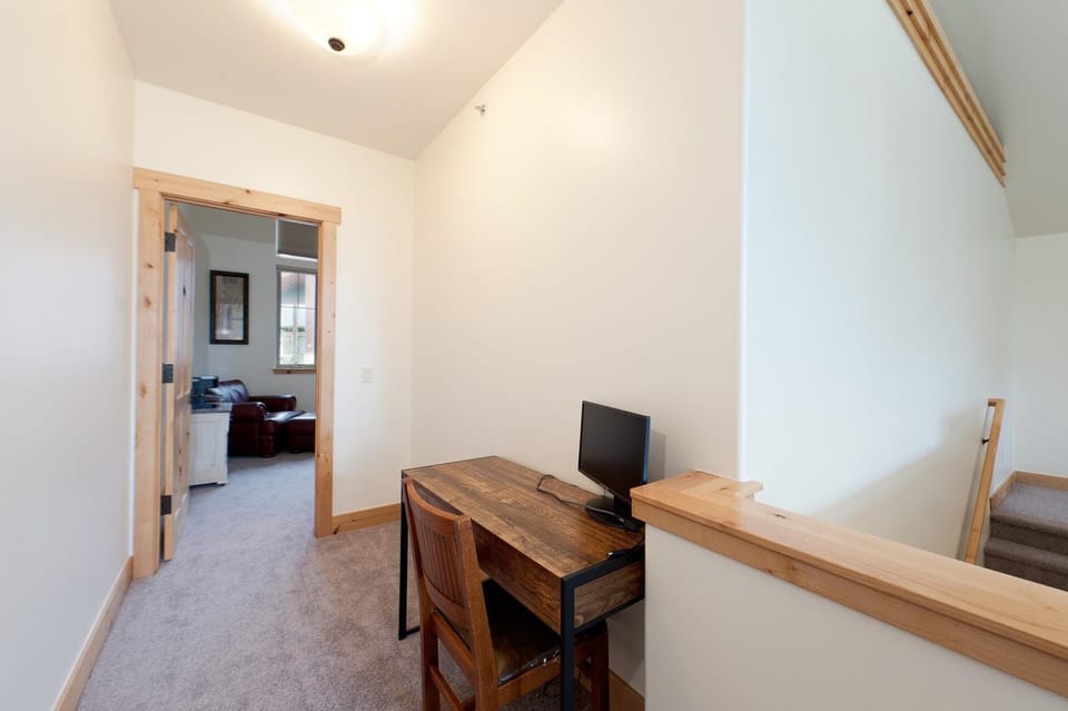 Desk with monitor outside Master Bedroom