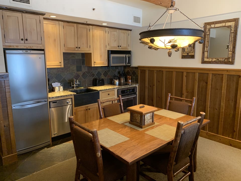 Fully equipped kitchen with custom alder wood cabinetry and granite countertops.