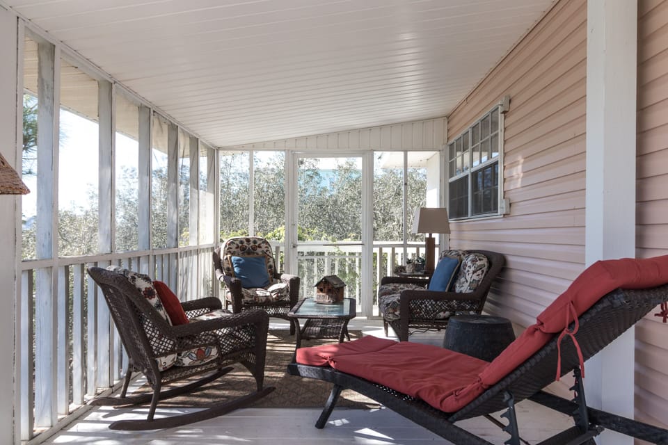 Relaxing screened porch also with dining area