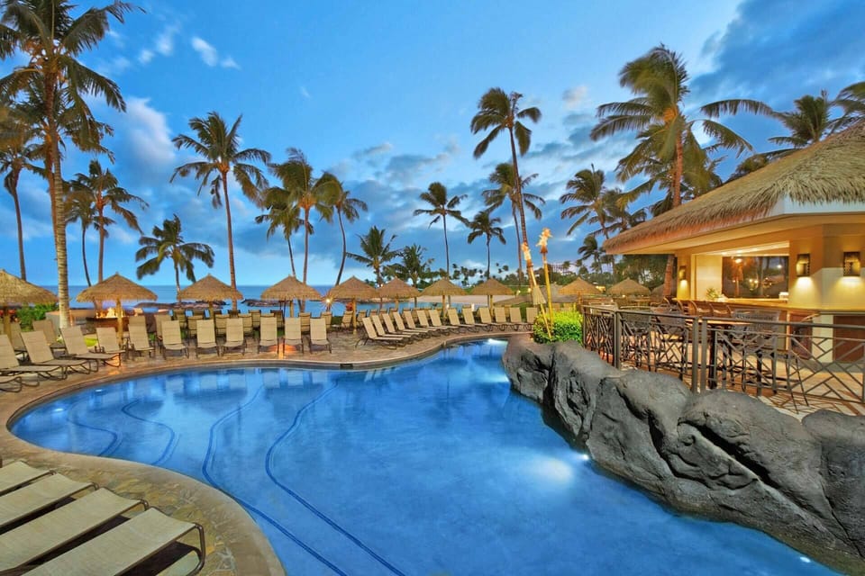 Outdoor heated pool with bar.