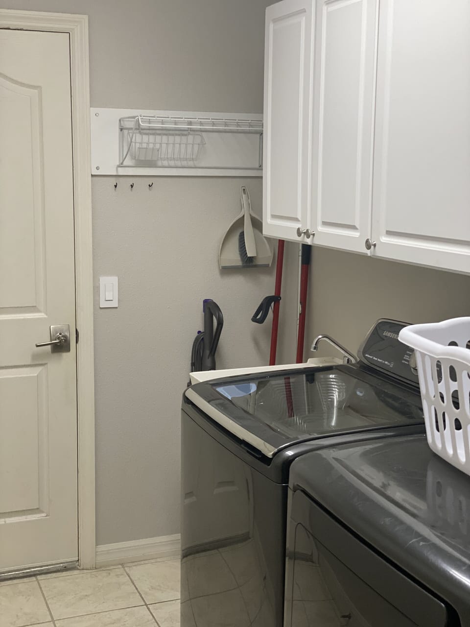 Attached Garage Entrance and Laundry Room with Washer/Dryer and Laundry Tub