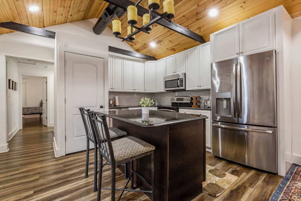 Modern kitchen island and bar seating — perfect for casual meals.