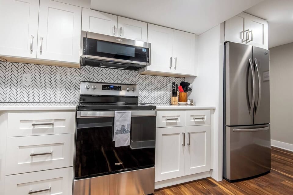 Kitchen- stainless steel stove and refrigerator 