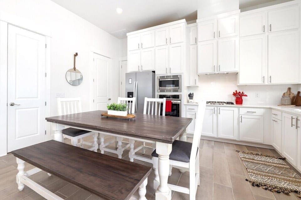 Directly behind the living room, you'll see our 6-top dining table.