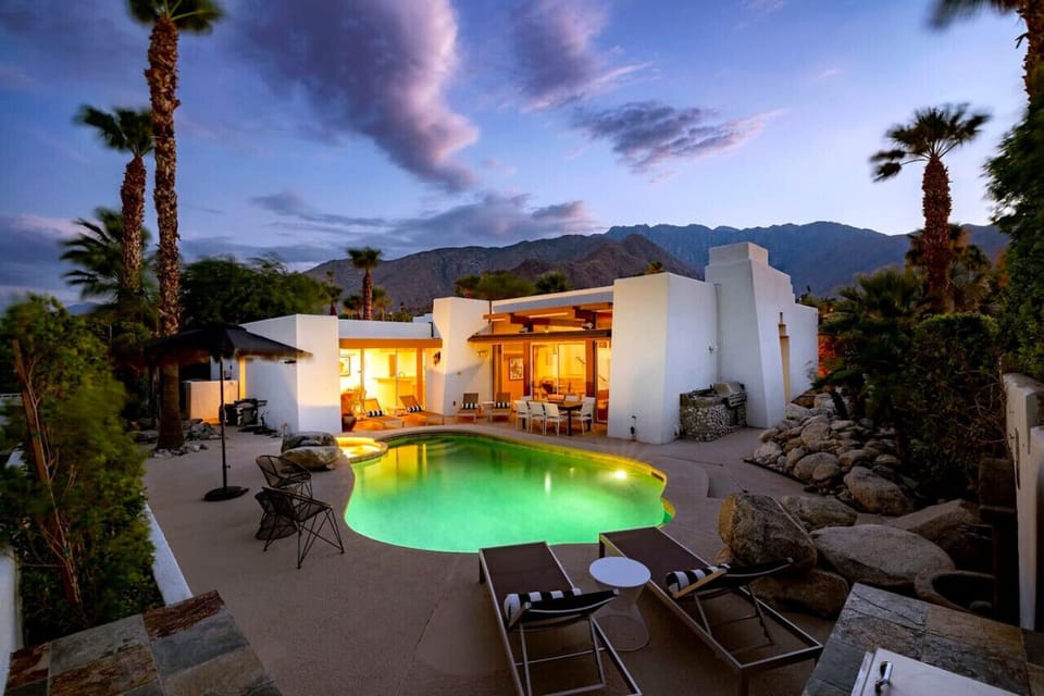 Desert oasis at dusk – where modern elegance meets serene mountain views.
