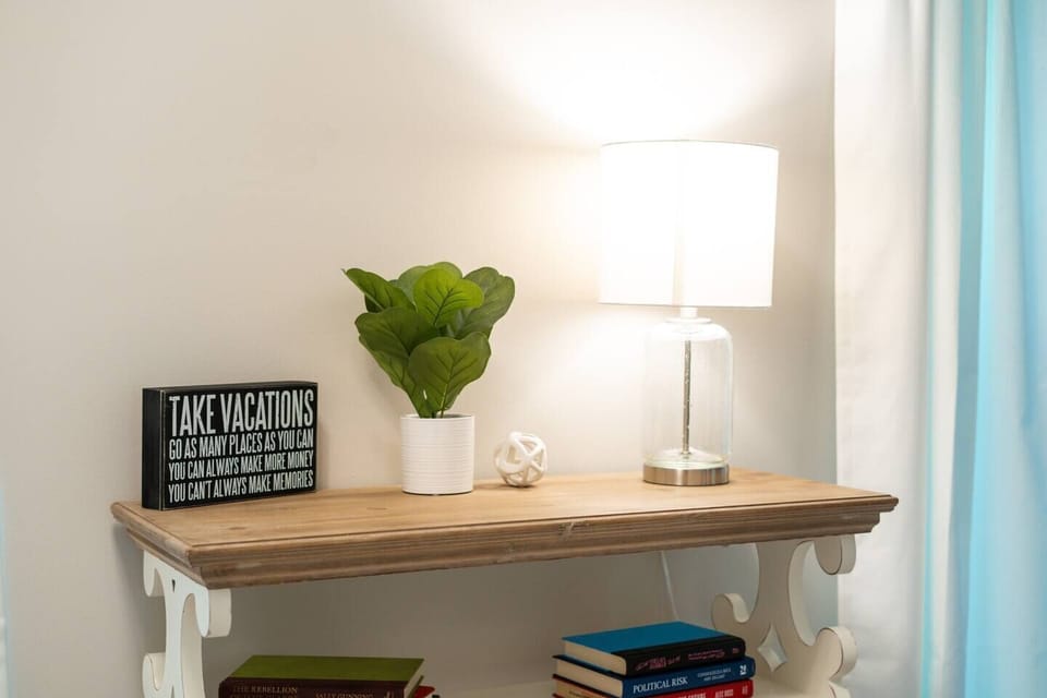 Second master suite is located upstairs. It contains a king bed, Roku TV, sitting area, attached bathroom, and entry to a private balcony