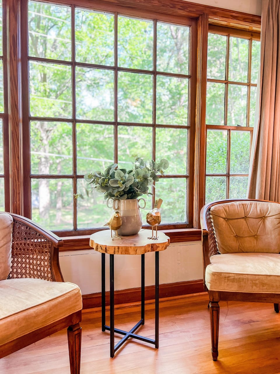 Enjoy a cup of coffee in the well-lit corner of the living room.
