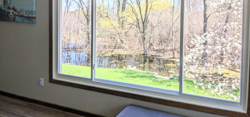 Panoramic view to the spacious backyard with creek for you to enjoy!