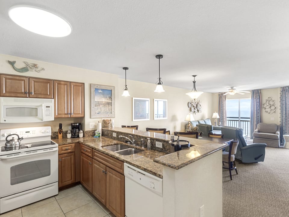 Your fully equipped kitchen flows seamlessly into the living space, perfect for preparing meals while staying connected with family and friends.