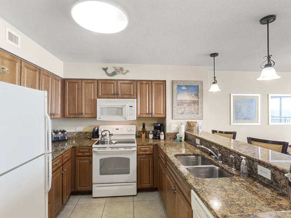 Your fully equipped kitchen features granite counters, modern appliances, and everything needed to prepare delicious meals during your stay.