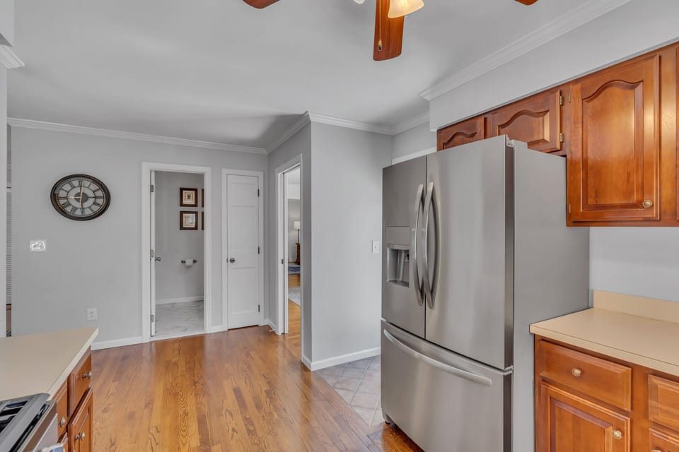 Kitchen w Stainless Steel appliances and ceiling fan