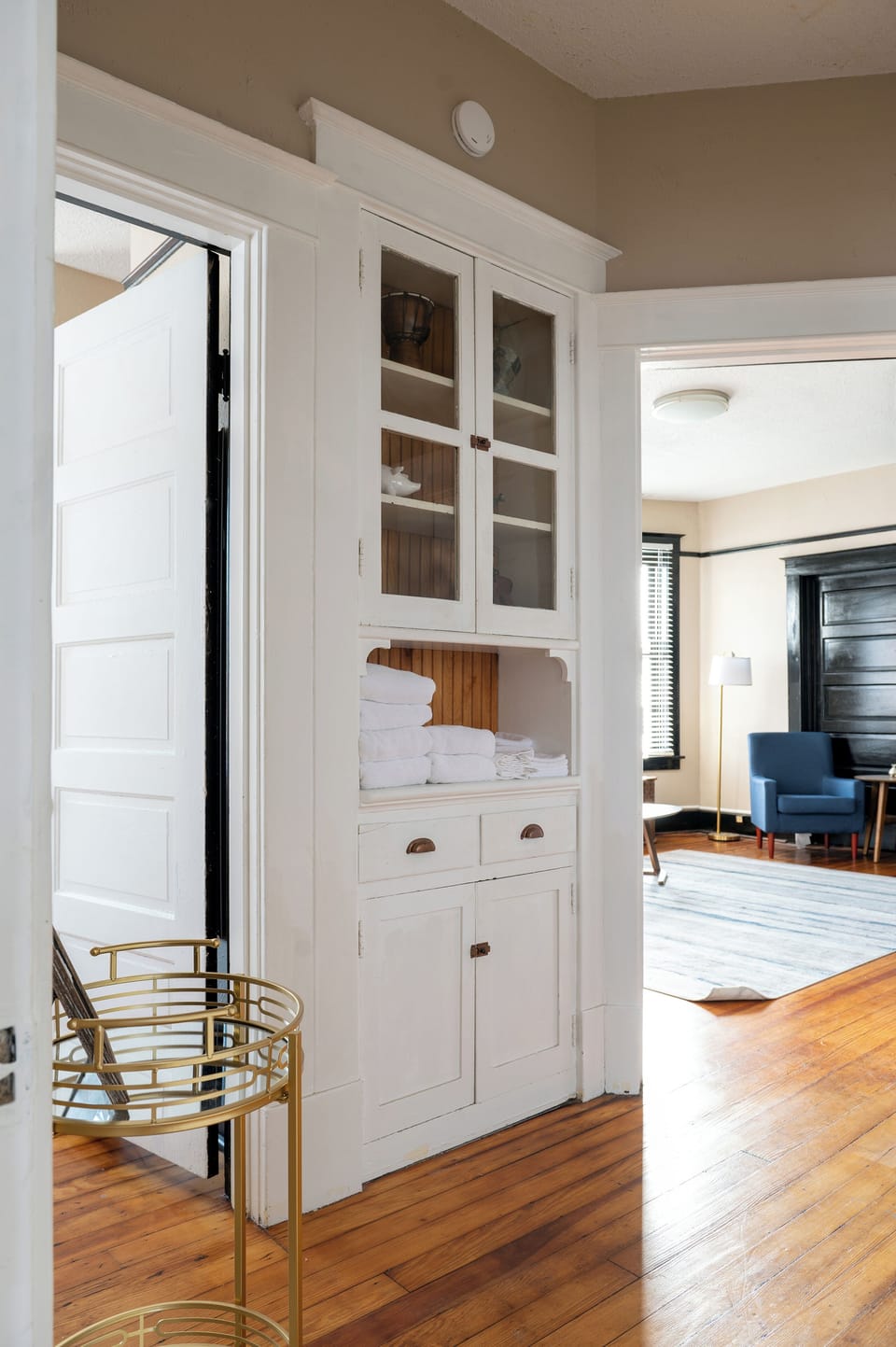 Linen closet with living room in background