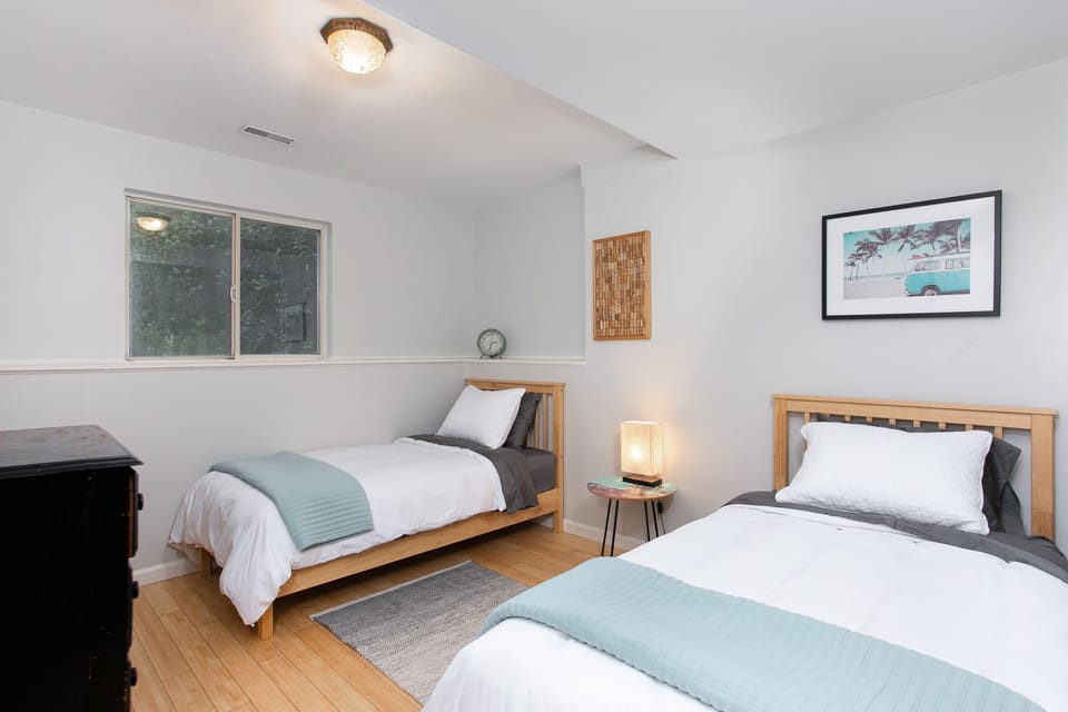 Lower-level twin bedroom; great setup for kids or flexible sleeping.