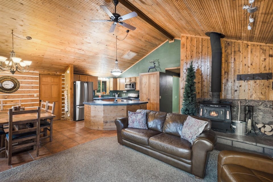 Living room open to kitchen and dining area with smart TV