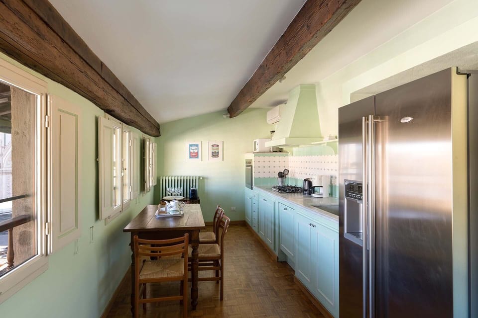 Kitchen has views of the piazza and of the Santa Croce basilica.