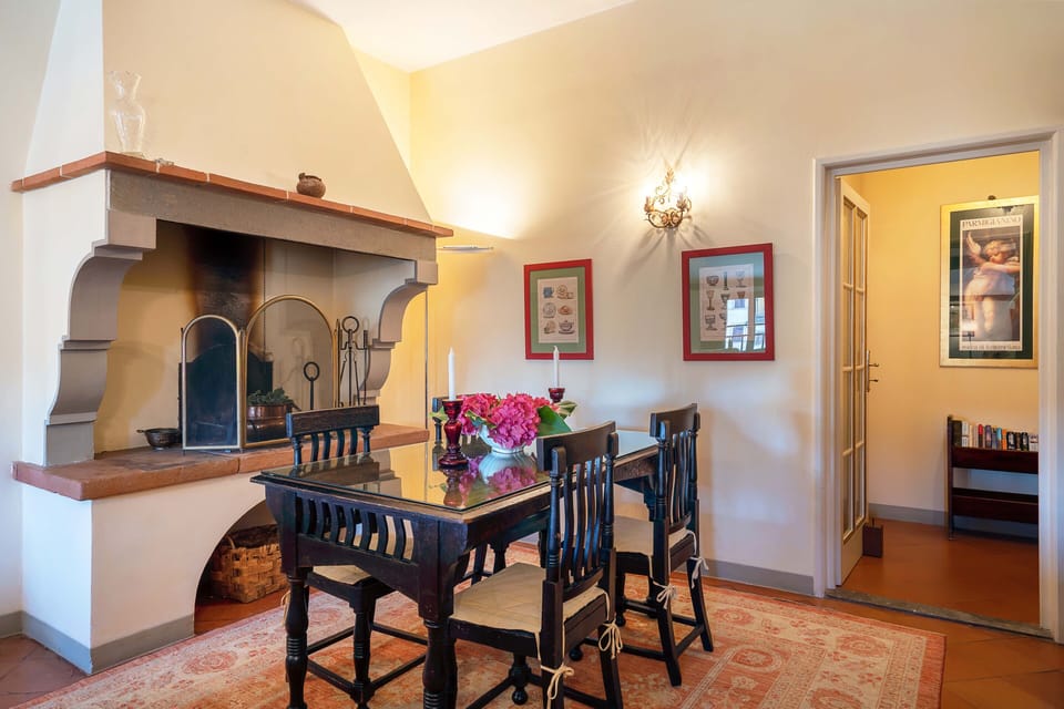 Lovely dining area with beautiful original fire place.
